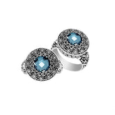 Handmade sterling silver Balinese ring with round-cut Blue Topaz Quartz and ornate engraved bezel.